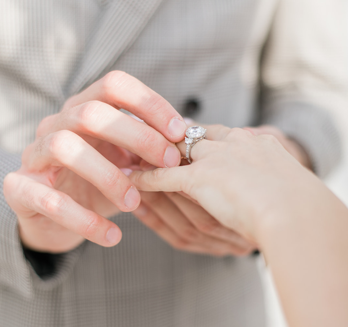 Man Proposes to Woman with a diamond ring at a romantic setting set up by Weddings by Address