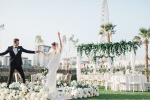 Bride and groom celebrating in an elegant outdoor wedding venue in Dubai at Address Hotels + Resorts.